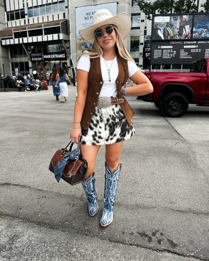 Instagram post by @kx_diamond for Dan Post Boot Company. Caption reads: Day 1 at the @calgarystampede & the very first day....