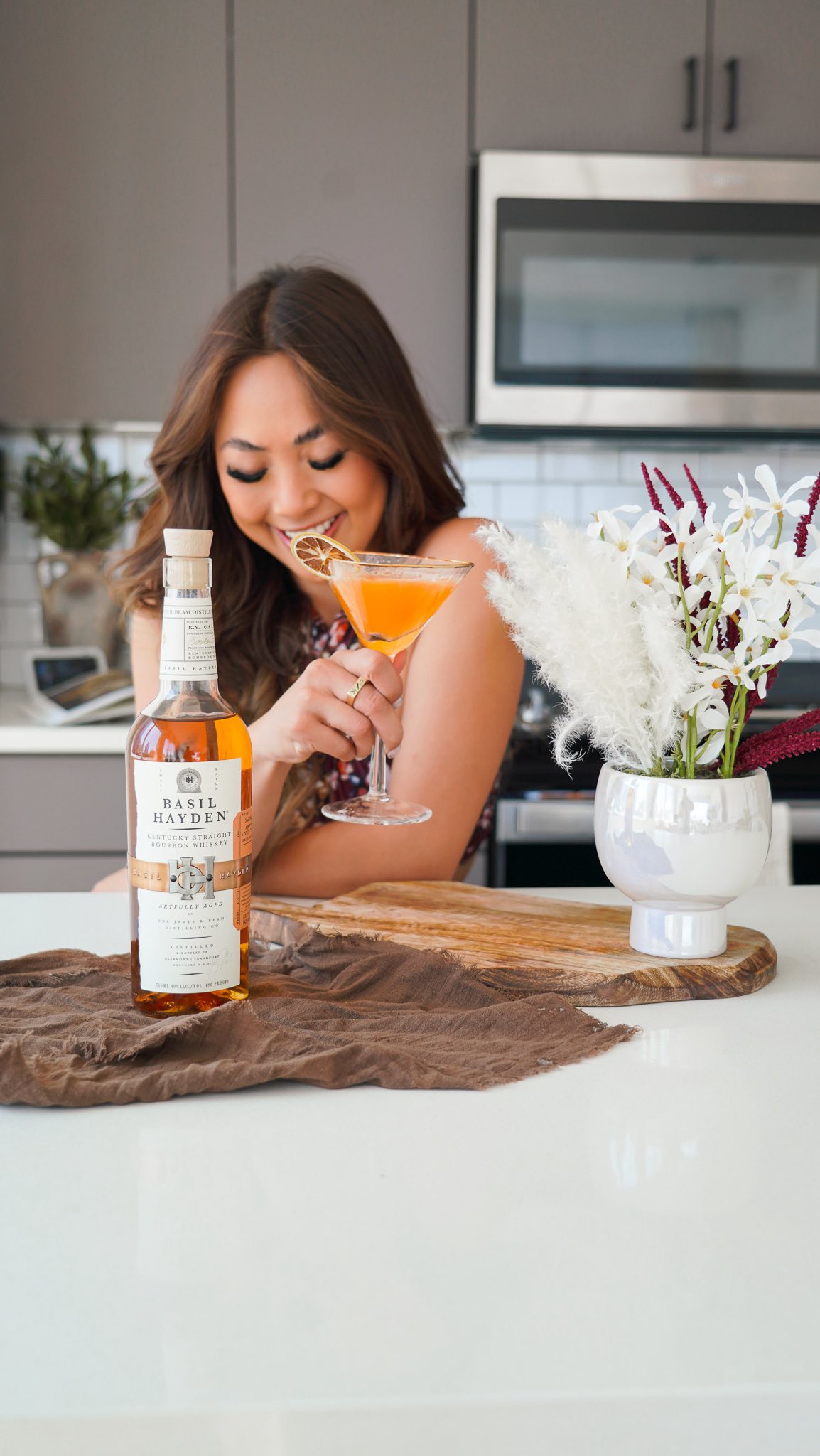 Instagram post by @sincerelyreneze for Basil Hayden. Caption reads: #ad21+ Let’s be real, summer doesn’t officially....