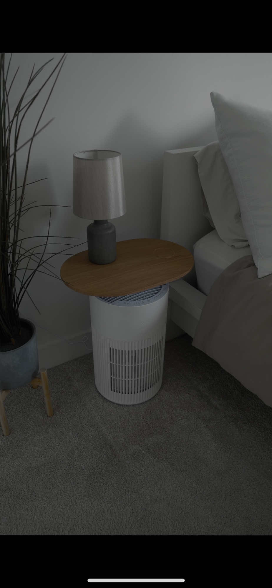 TikTok post by @dane_mcbeth for SwitchBot. Caption reads: The @SwitchBot Air Purifier Table is the Ultimate....
