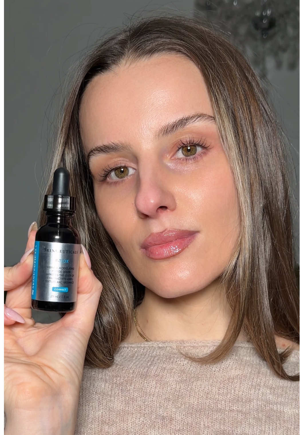 TikTok post by @juuujubee for SkinCeuticals. Caption reads: Building my Glass Skin routine with @SkinCeuticals....