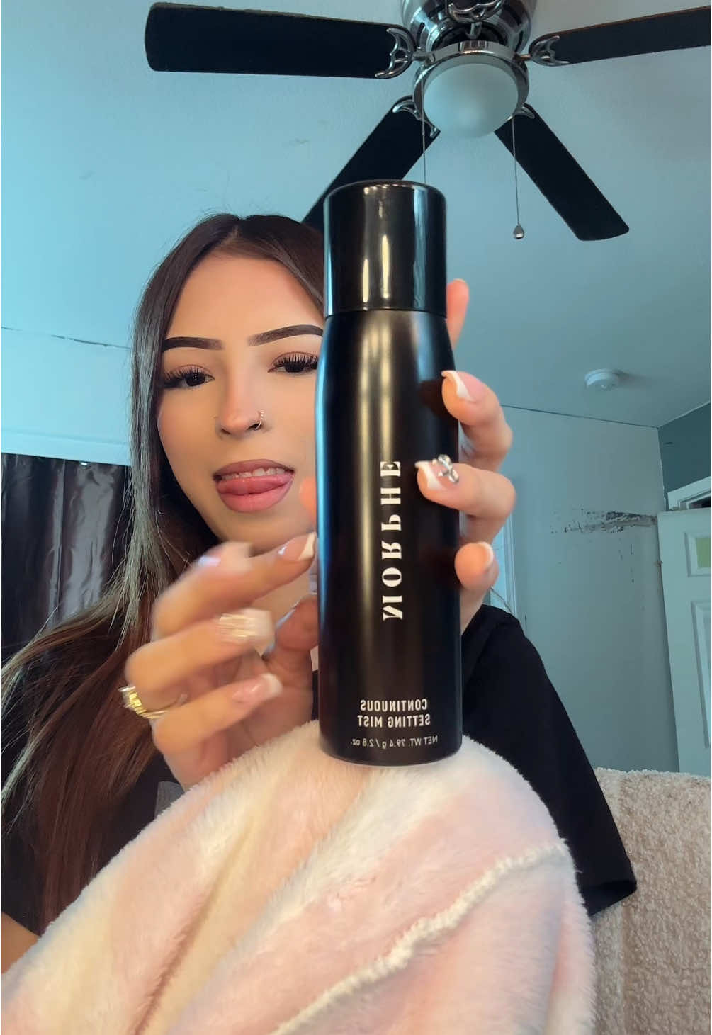 TikTok post by @millionnndollarrpussayy for Bomb Cosmetics UAE. Caption reads: honestly bomb.com #foryou #fypシ #settingspray....