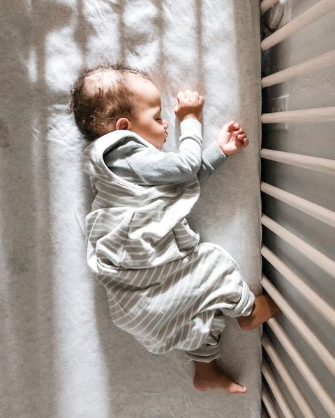 Instagram post by @e_henry125 for Woolino. Caption reads: [...] my baby is perfectly snuggled up in his....