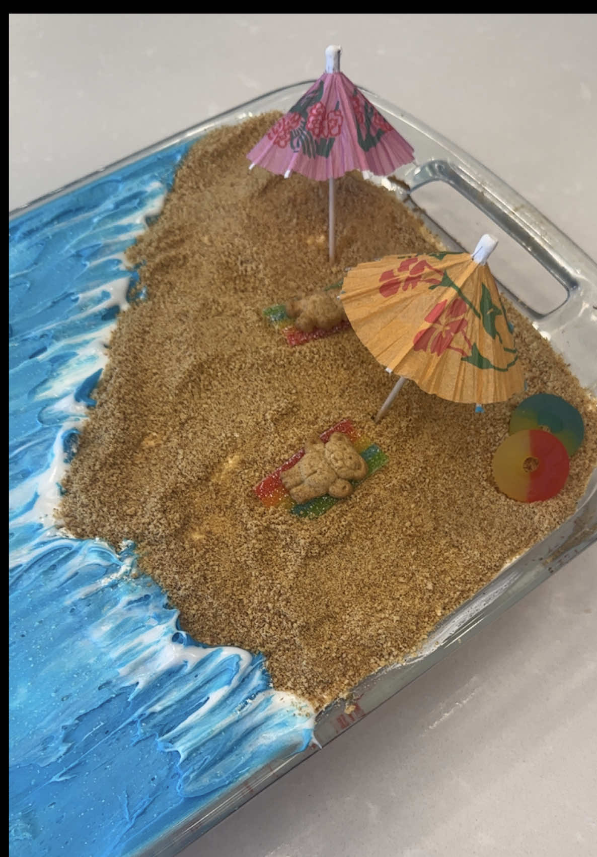 TikTok post by @kennedychugg for discoveryplus. Caption reads: SHARK WEEK CAKE 🦈🏝️❤️ I was a shark kid and am....