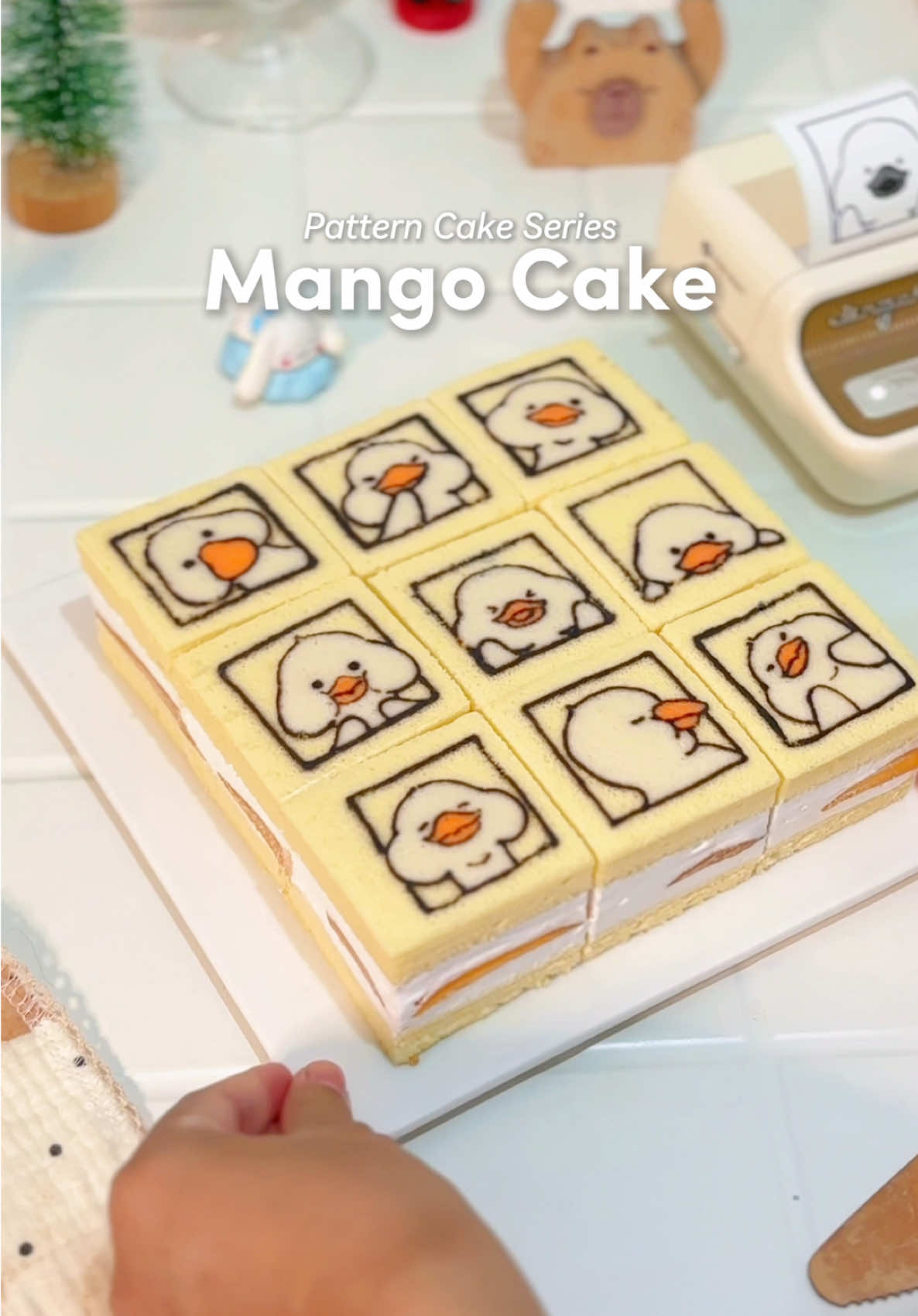 TikTok post by @ichahomecafe for NIIMBOT. Caption reads: let's make the cutest mango cake! 🥭 🍰 this cake....