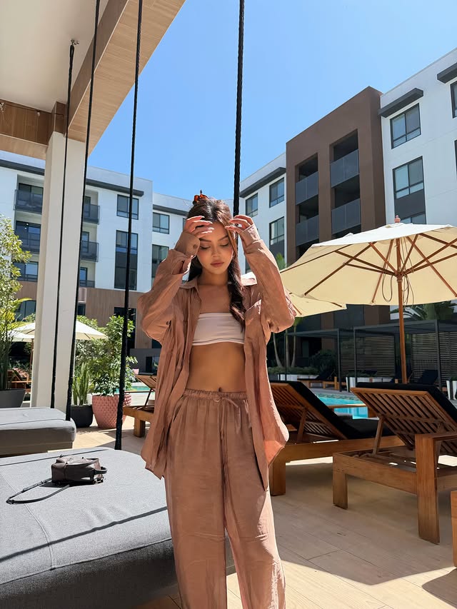 Instagram post by @lilymaymac for Alo Yoga. Caption reads: Day by the pool? @alo #aloPartner.