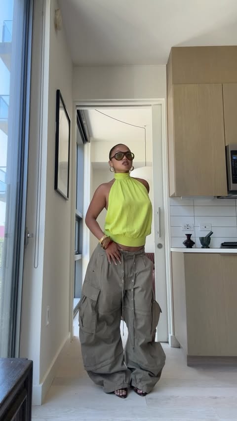 Instagram post by @itsvaybeeh for Free People. Caption reads: Big pants and bright colors 🧑🏽‍🩰 @freepeople....