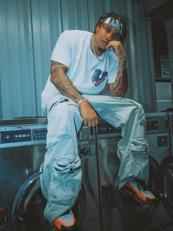 Instagram post by @rotimi for True Religion. Caption reads: Nothing extra, just true @truereligion 🔥#TeamTrue....