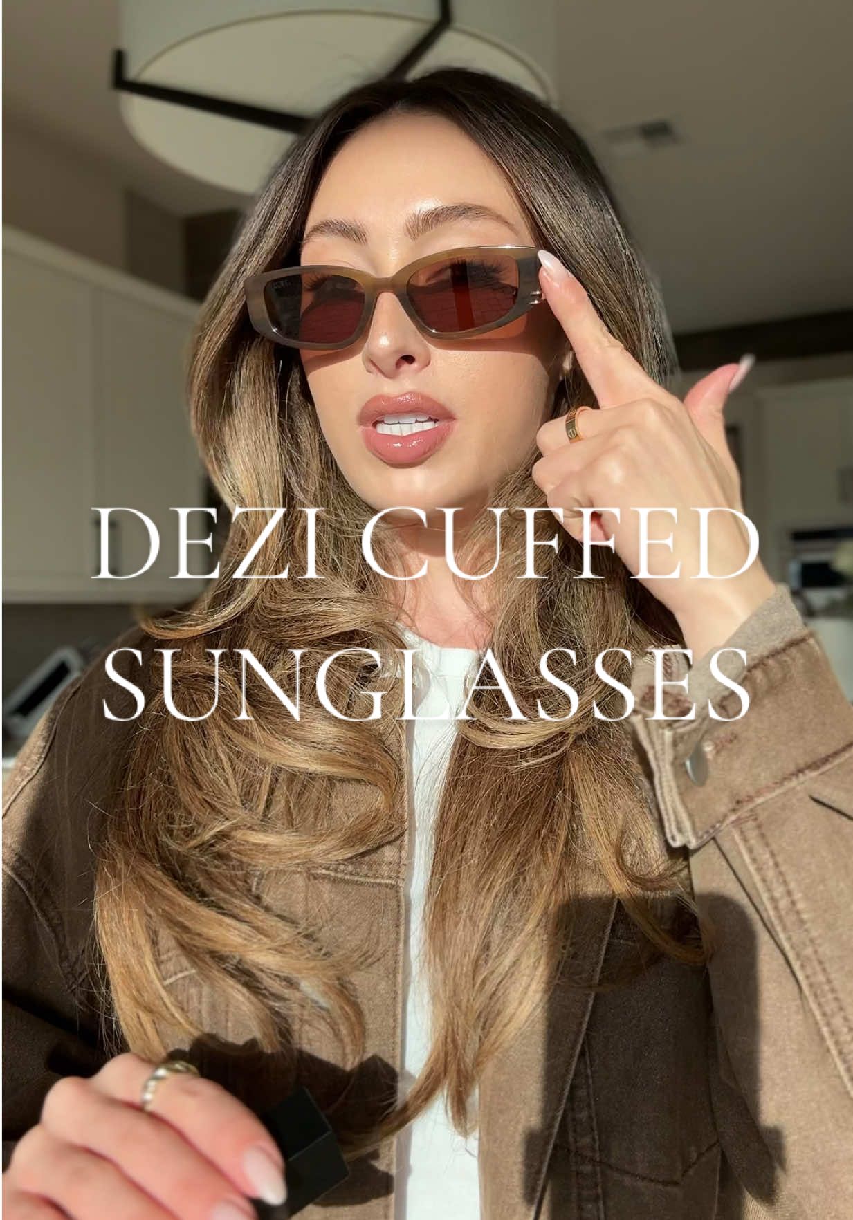 TikTok post by @briannametzger1 for DEZI. Caption reads: [...] Stunning on any face shape 🤎 #dezi....