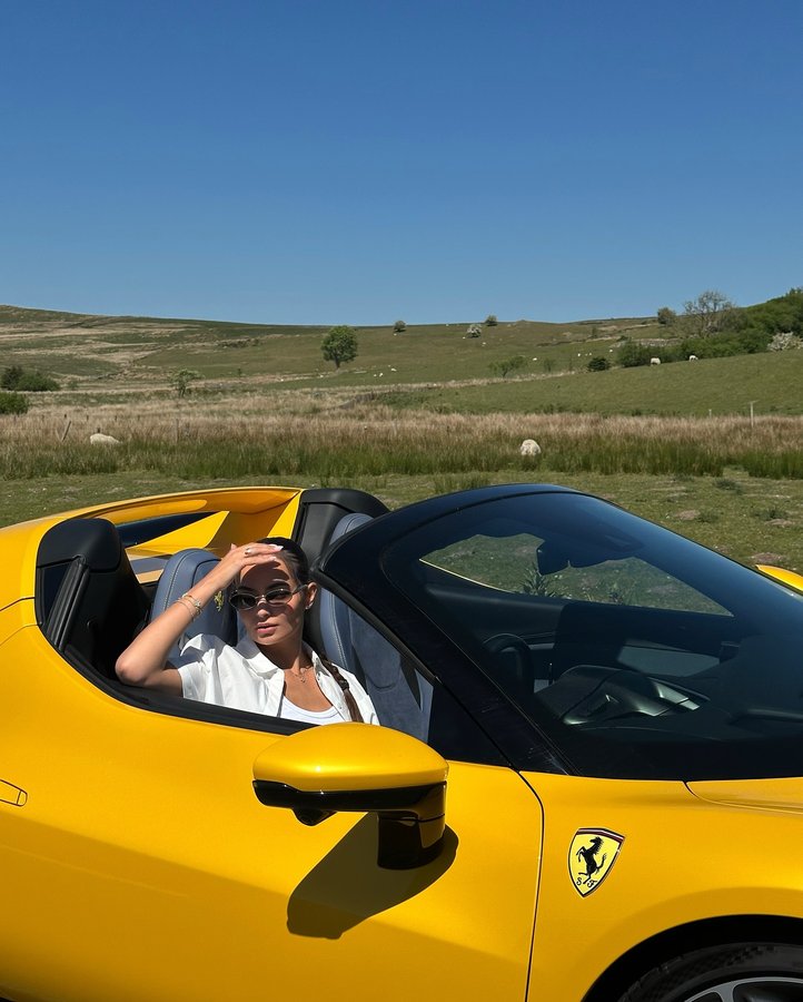 Instagram post by @cat_roberts_ for Ferrari. Caption reads: [...] car I have driven. I 💛 you 296 GTS....