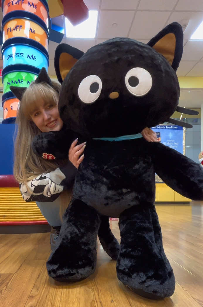 TikTok post by @heavenlysdolls for Sanrio. Caption reads: Let’s stuff the GIANT Chococat build a bear, what....