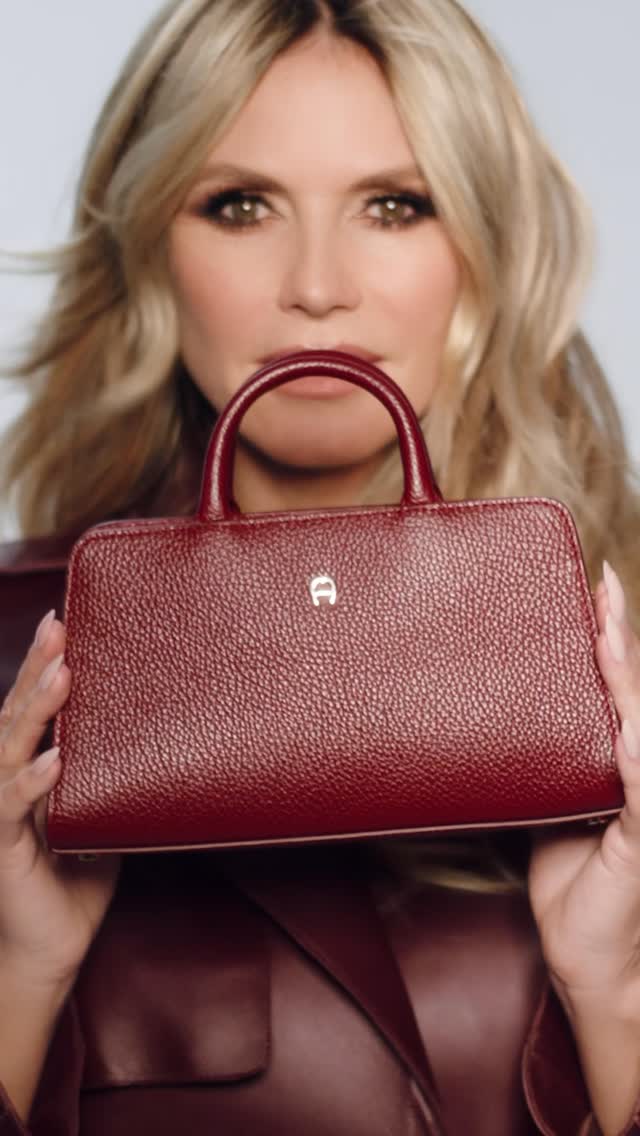 Instagram post by @heidiklum for Etienne Aigner AG. Caption reads: @aignermunich ❤️ #ad 
Danke @rankinarchive....