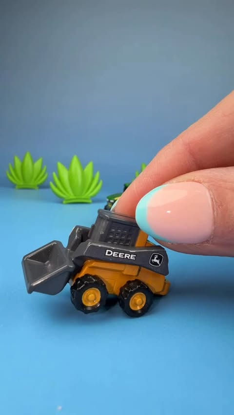 Instagram post by @kellysminiverse for John Deere. Caption reads: Ever see a CUTER tractor?!?
John Deere ERTL Mini’s....