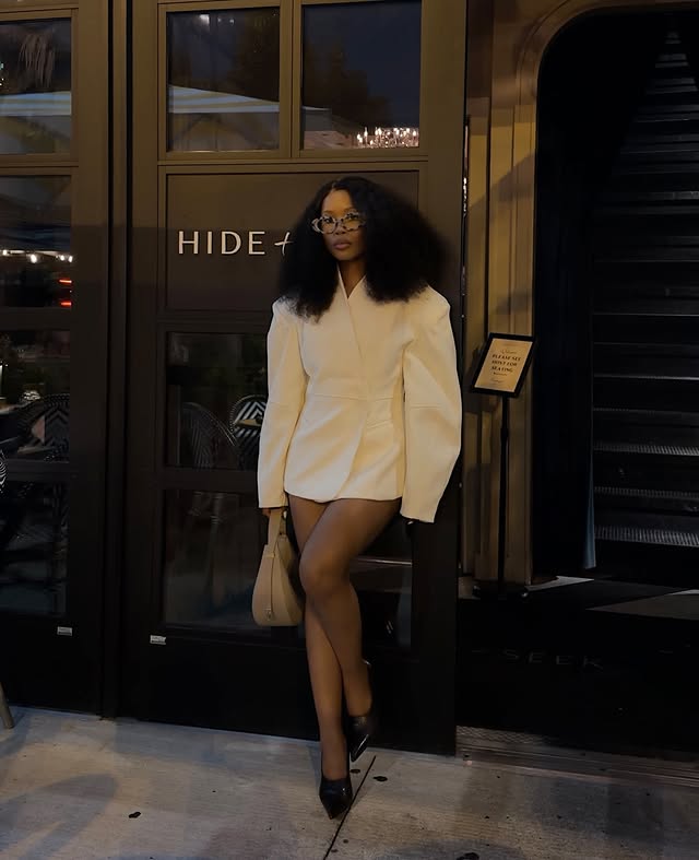 Instagram post by @lwethu_mcusi for JustFab. Caption reads: [...] at heart. Blazer | @missguided Shoes |....
