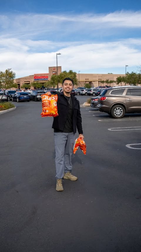 Instagram post by @athlete_m.e for Quest Nutrition. Caption reads: They're back in Costco! @questnutrition Protein....