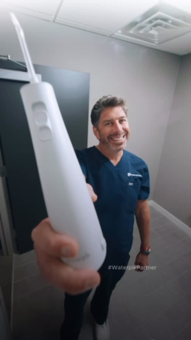 Instagram post by @bloodytoothguy for Waterpik. Caption reads: As a board certified oral and maxillofacial....
