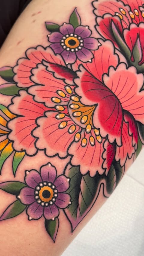 Instagram post by @katietattoos for World Famous Tattoo Ink. Caption reads: 🌸Florals Forever🌸 Flowers will always be one of....