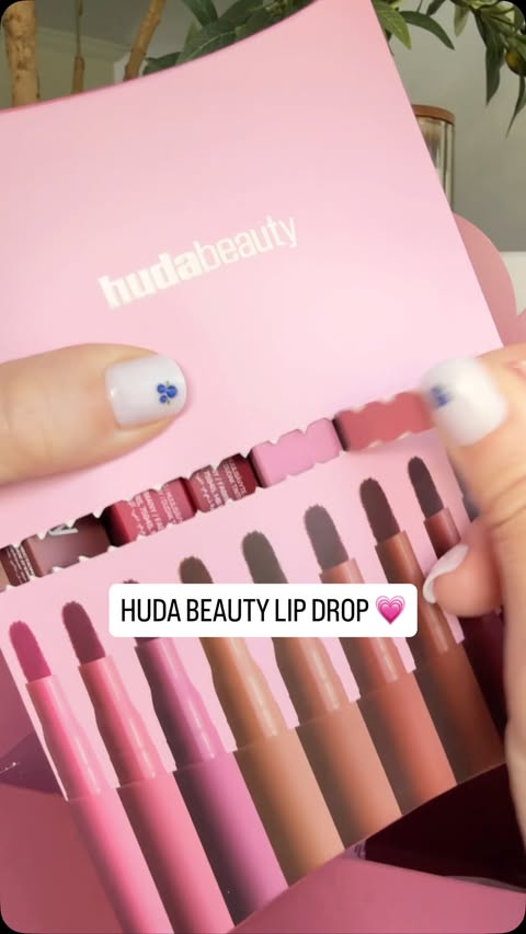 Instagram post by @miami_beauty_reviews for HUDA BEAUTY. Caption reads: [...] unboxing I’ve done in a while. 💗....