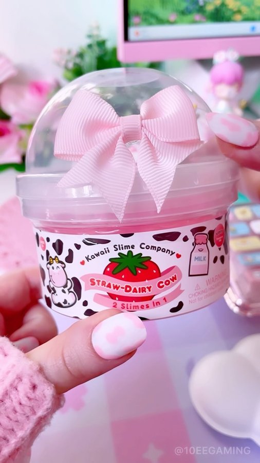 Instagram post by @10eegaming for Kawaii Slime Company. Caption reads: 🍓 StrawDairy Cow Slime 🍓 Unboxing a fun slime....