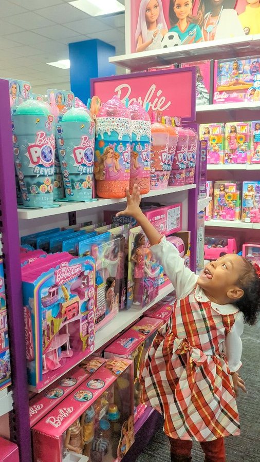 Instagram post by @novelleandmommy for Toysrus. Caption reads: ✨ Gifting Magic at Toys"R"Us at Macy's Herald....