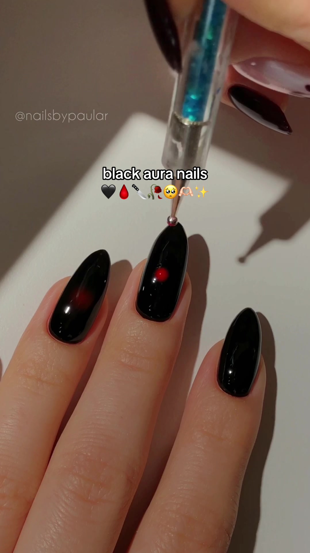 TikTok post by @nailsbypaular for MelodySusie. Caption reads: black aura nails! 🖤🩸🔪 this is, without a doubt,....