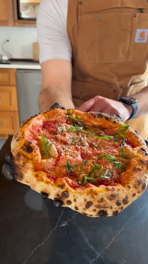 Instagram post by @pizzaioloharri for Ooni. Caption reads: The new Ooni Compact Pizza Peel is a serious [...].