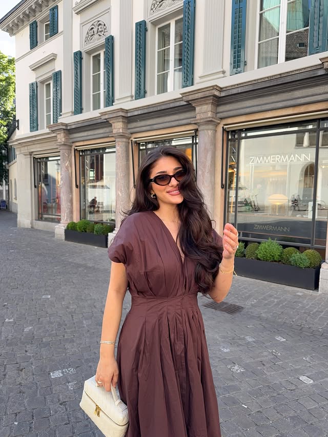 Instagram post by @buketkartaloglu for NA-KD. Caption reads: Zürii + 🌞🍦🫶🏽🌼 ad outfit from @nakdfashion.