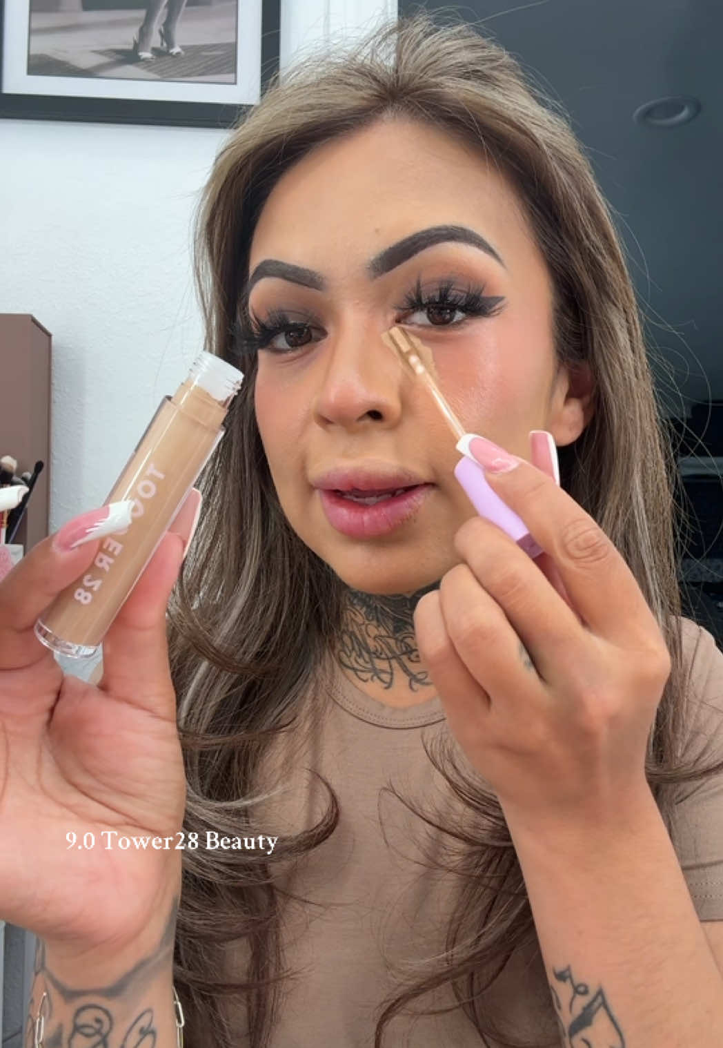 TikTok post by @queenxmelissa for Tower 28 Beauty. Caption reads: [...] 9.0 - SERUM CONCEALER @Tower 28 Beauty....