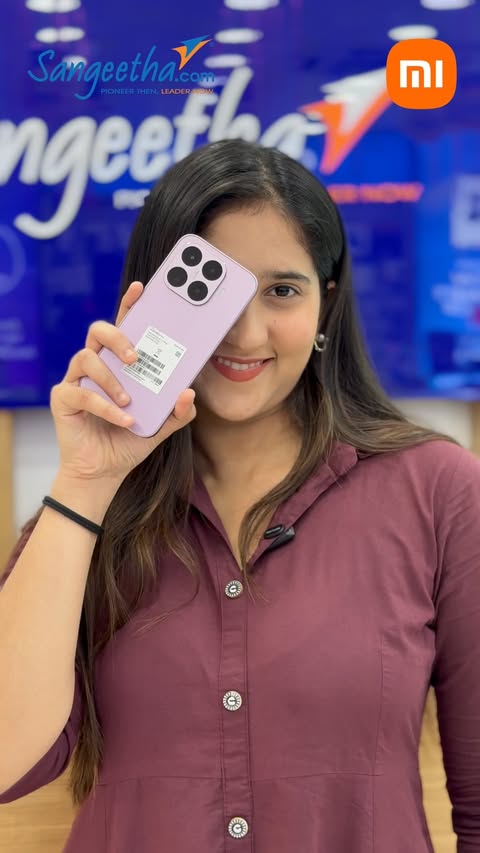 Instagram post by @saakshi_sb._ for Sangeetha Mobiles. Caption reads: New phone? ✔️ Amazing camera? ✔️ Unmissable....