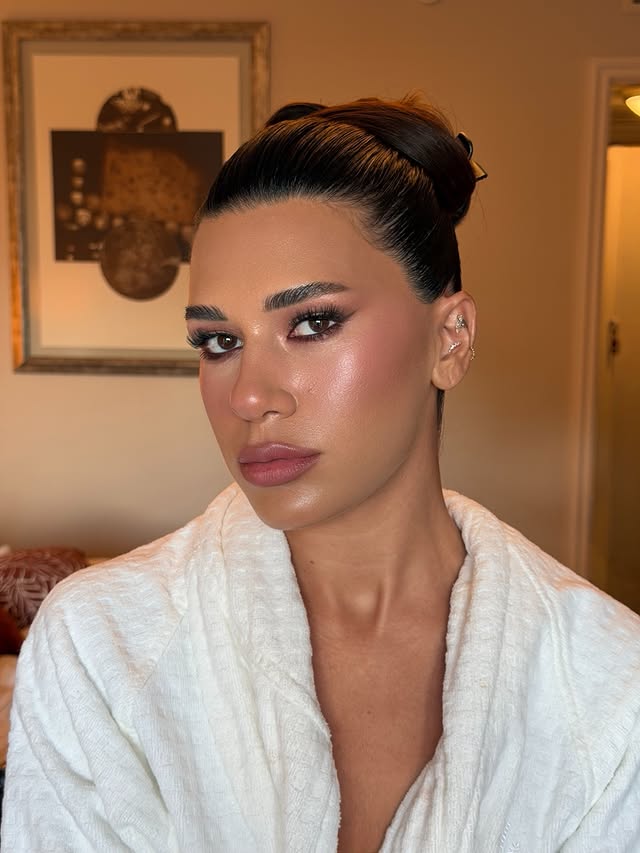 Instagram post by @serhatsenn for INGLOT COSMETICS. Caption reads: Smoked-out burgundy eyes, luminous skin & a soft....