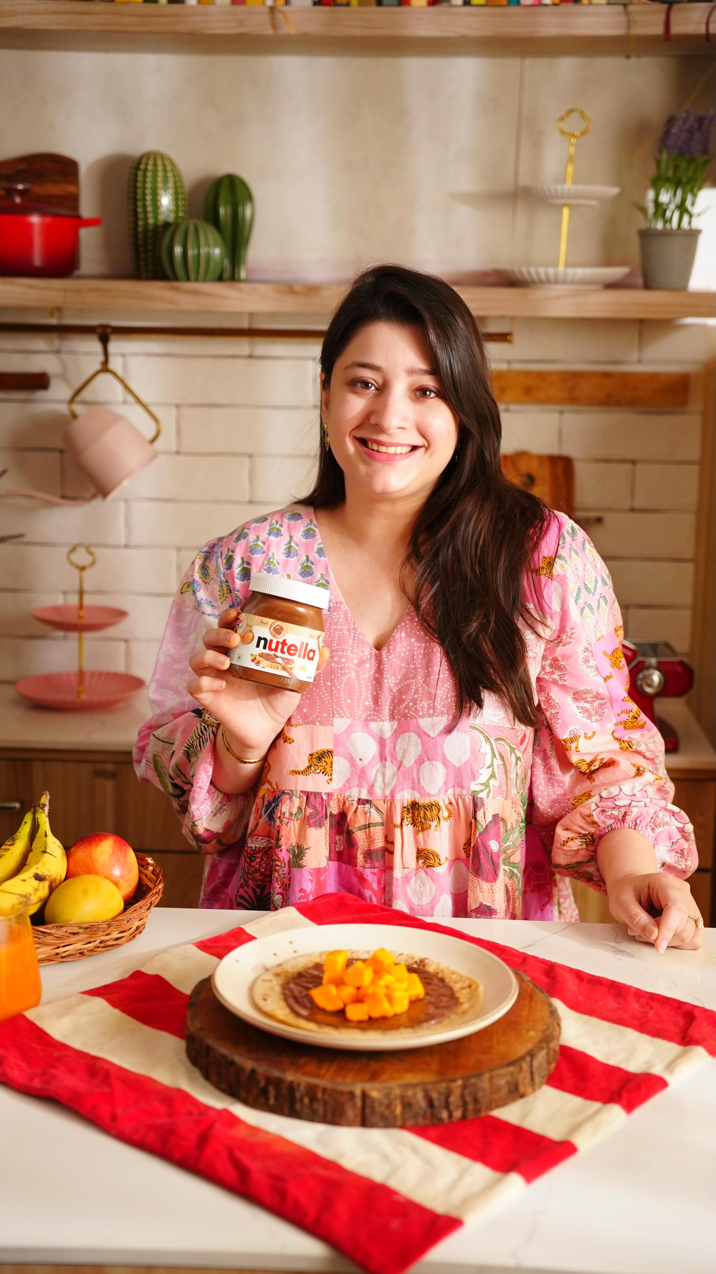 Instagram post by @natashaagandhi for Nutella. Caption reads: Nutella makes everything better- even....