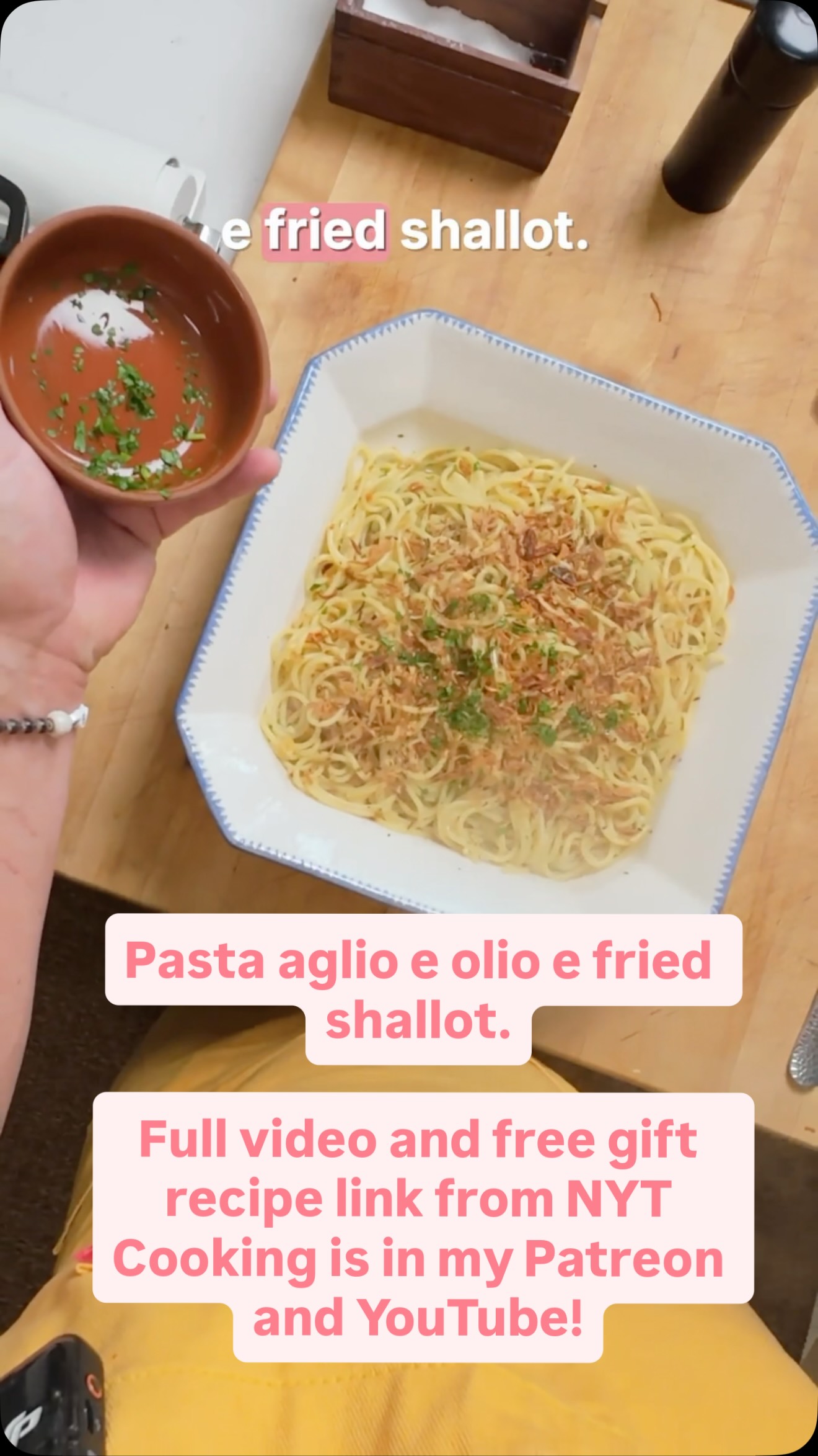 Instagram post by @kenjilopezalt for NYT Cooking. Caption reads: Classic aglio e olio gets an upgrade with a....