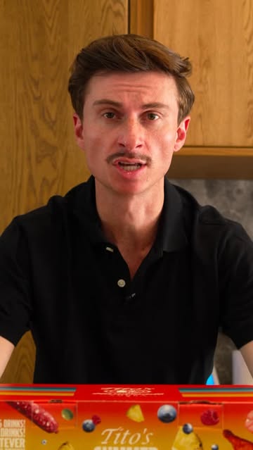 Instagram post by @trevorwallace for Tito’s Handmade Vodka. Caption reads: Man up, Can down. @titosvodka #ad.