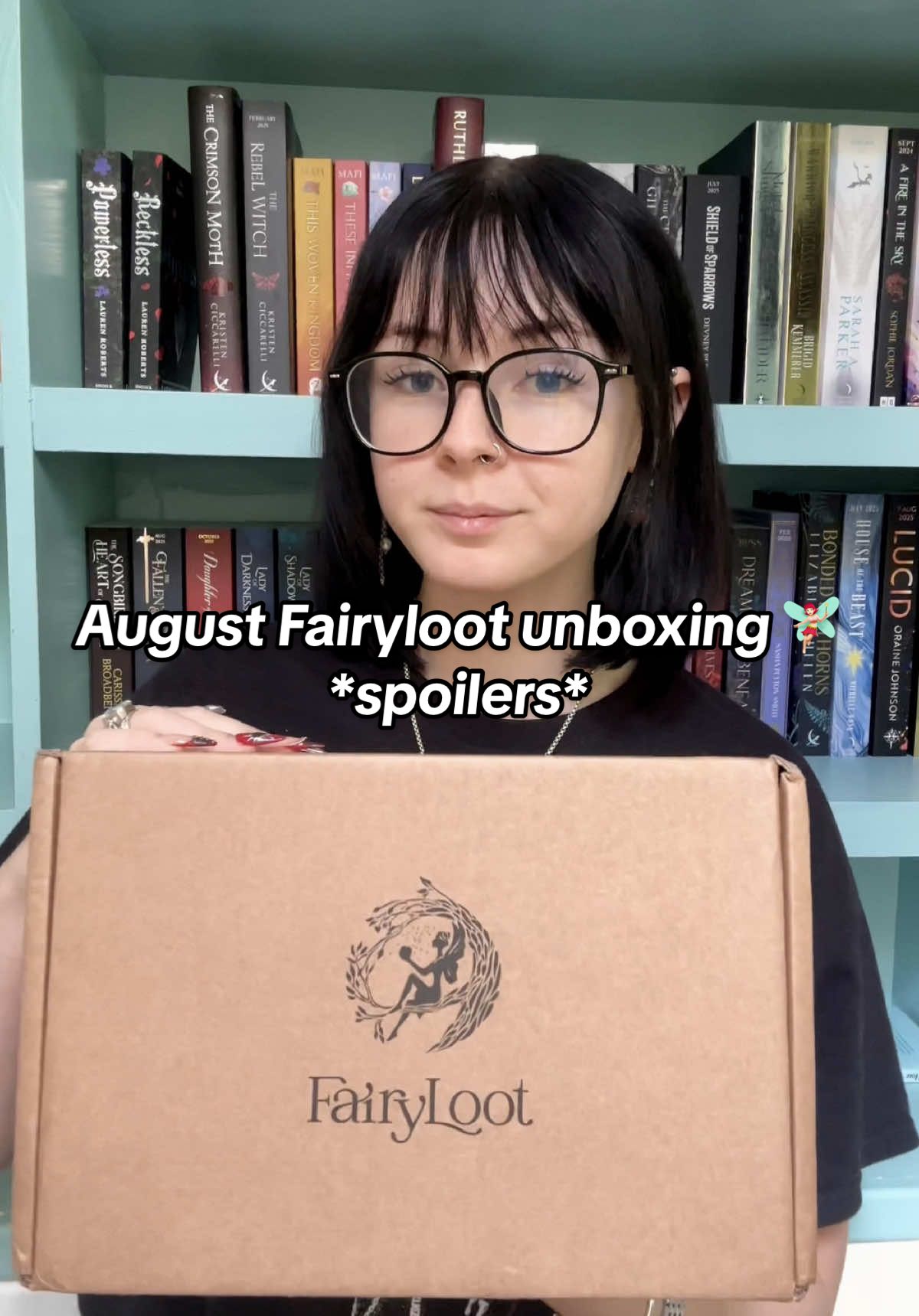 TikTok post by @bookswithgray for FairyLoot. Caption reads: let's unbox my 3-book August @FairyLoot rep box....