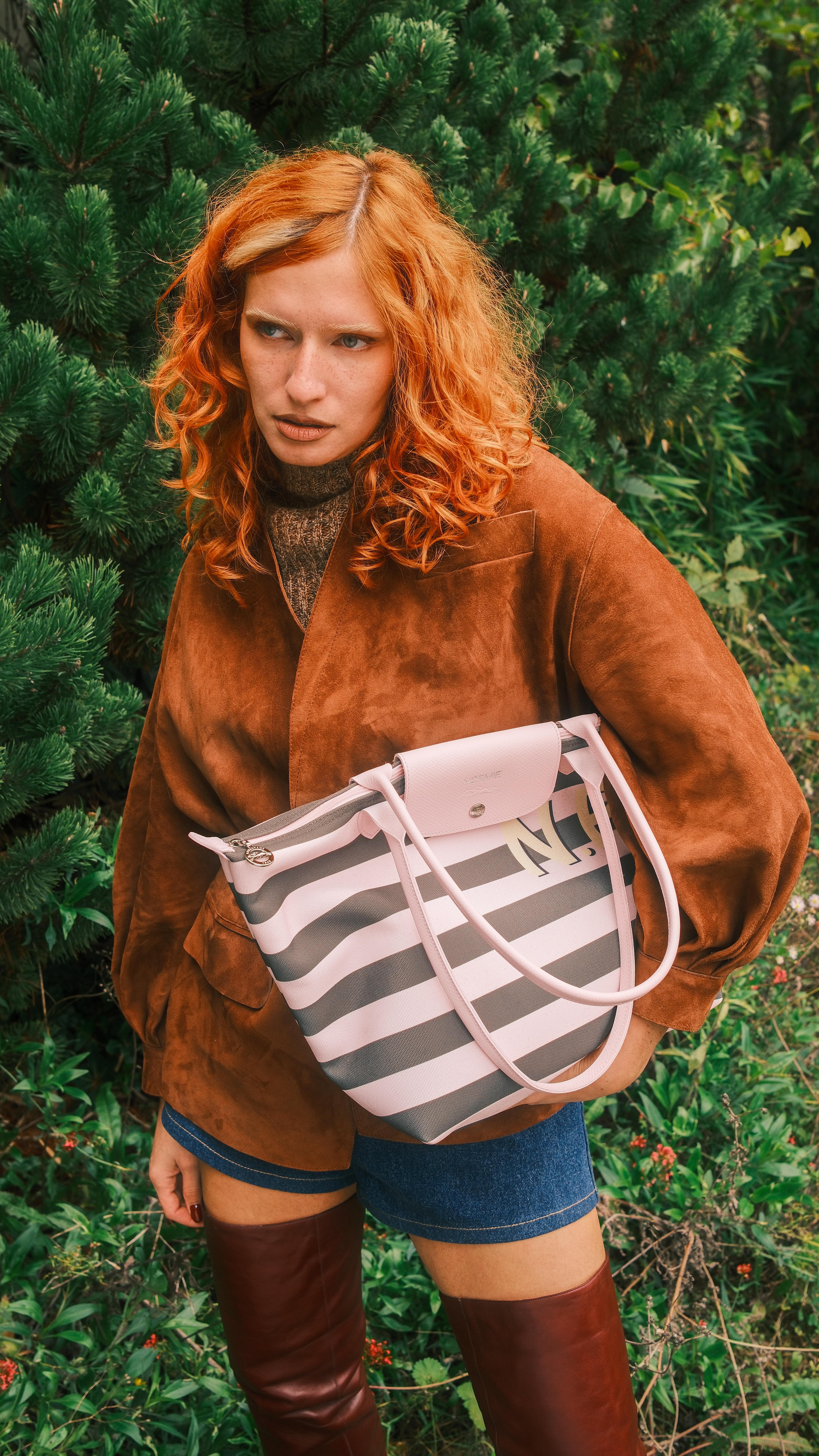 Instagram post by @pinoemie_ for Longchamp. Caption reads: filmed in selfie mode by accident but clearly the....