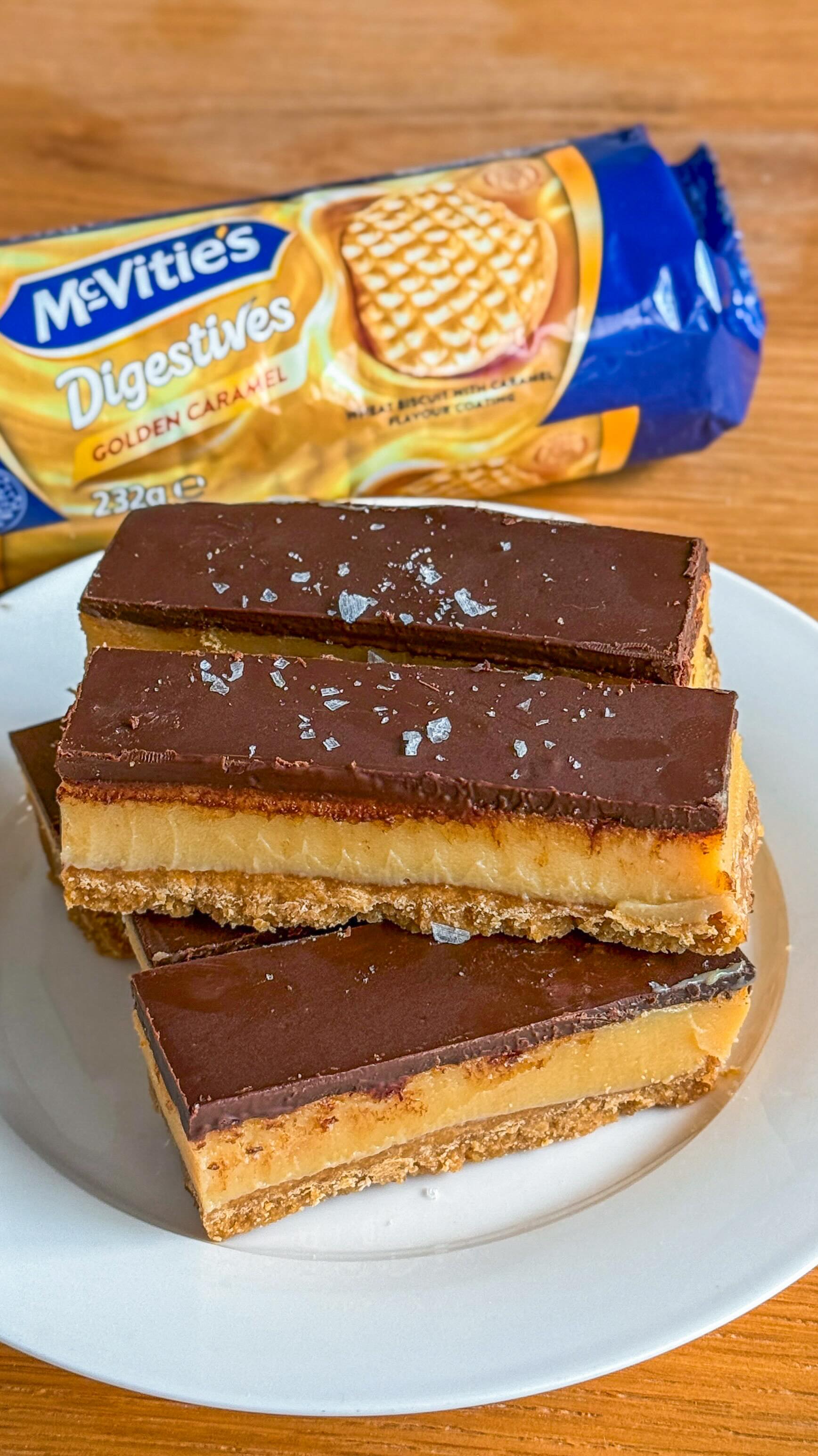 Instagram post by @sydneyfoodspotter for McVitie's. Caption reads: [...] slice 🍫💛 Recipe👇🏼 We used the new....