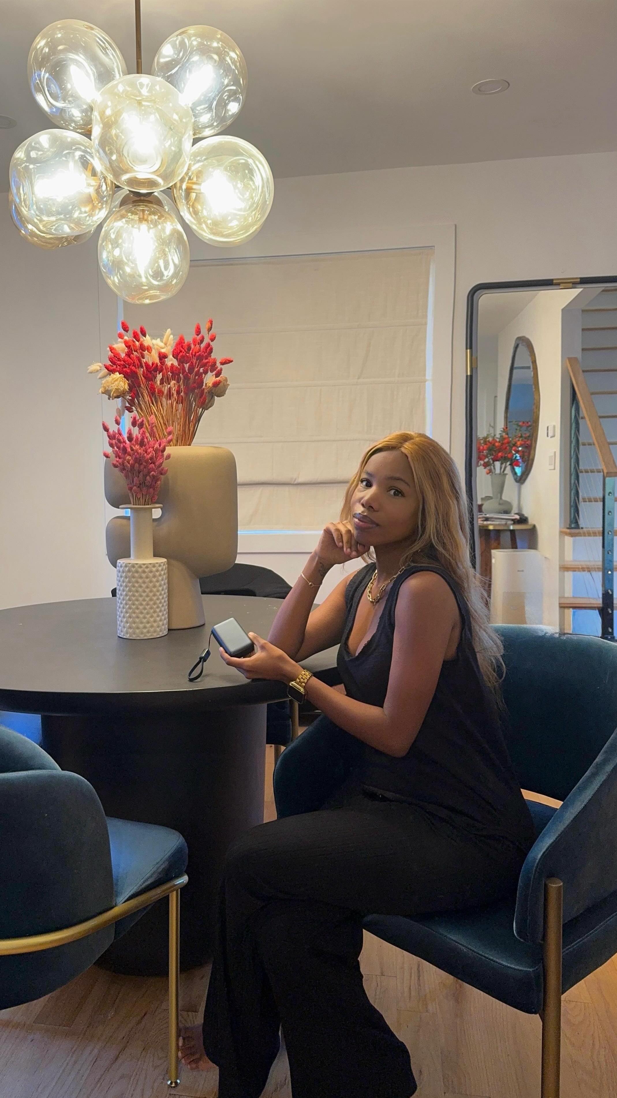 Instagram post by @_simplytasia_ for INIU Shop. Caption reads: A full day on the move means my phone can’t afford....