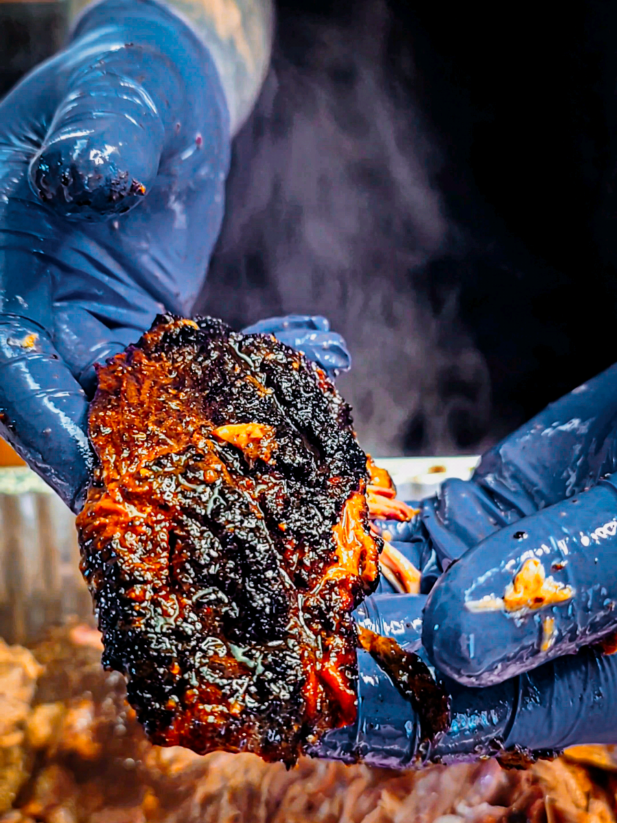 TikTok post by @jstewsbbq for ThermoWorks. Caption reads: Slow-smoked, injected, butter-bathed pulled pork....