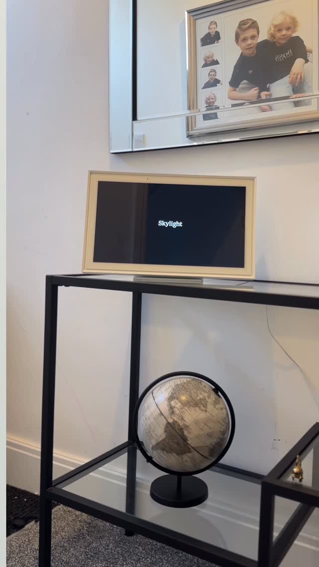 Instagram post by @amberbutlerx for Skylight Frame. Caption reads: Keeping our busy family connected (and a bit less....