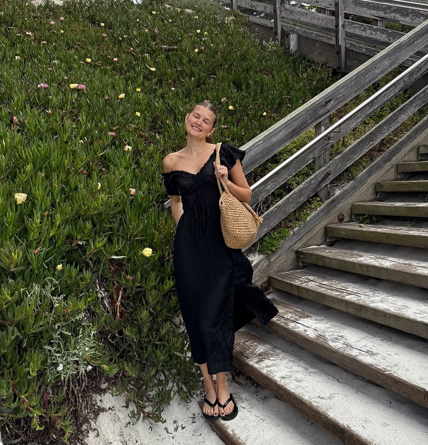 Instagram post by an influencer for J.Crew. Caption reads: The perfect dress by the sea @jcrew #InJCrew.