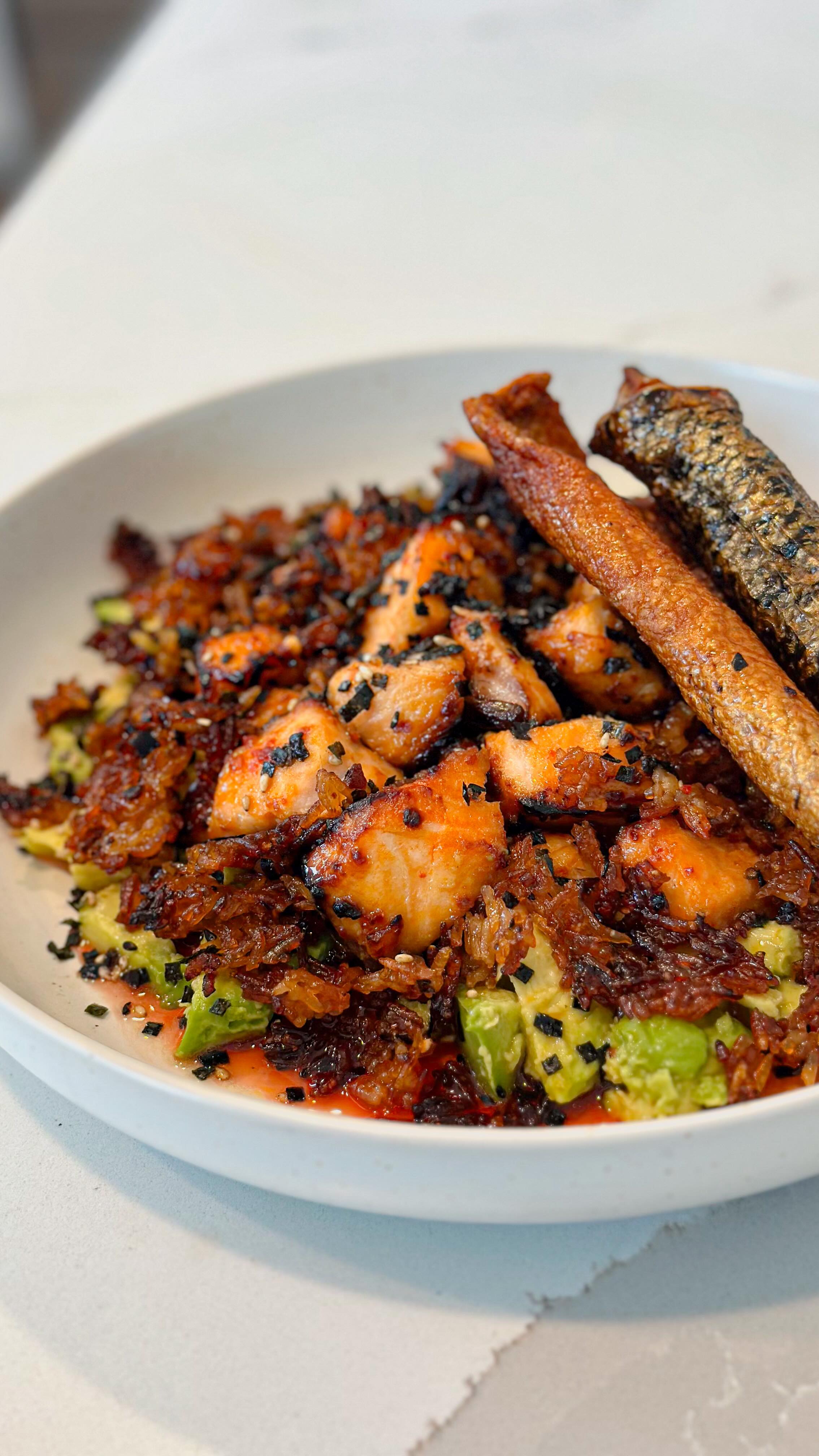 Instagram post by @eatsallornothing for Bluehouse Salmon. Caption reads: Bluehouse Salmon & Airfried Crispy Rice 🥑 Recipe....