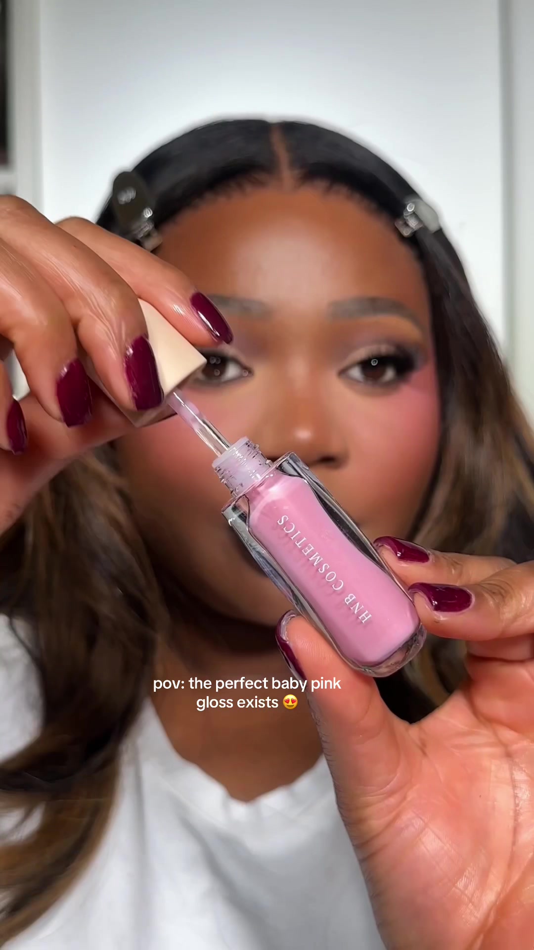 TikTok post by @makeupbymissevelyn for HNB Cosmetics. Caption reads: this gloss 😍💕 @HNB Cosmetics shine lipgloss 12....