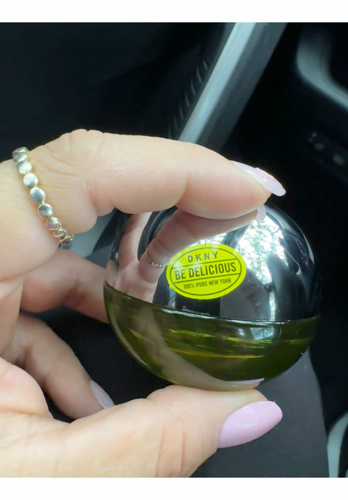 TikTok post by @faigilove for DKNY. Caption reads: [...] like green apple lately 🍏💫 @DKNY #dkny....