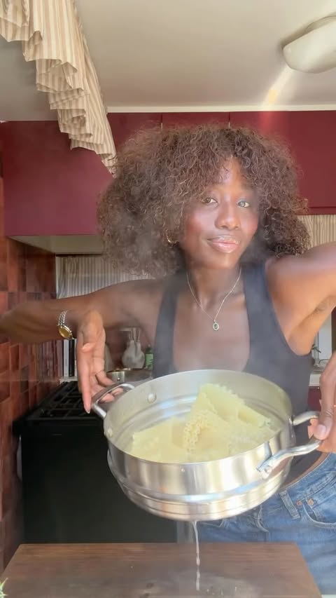 Instagram post by @rotiibrown for KitchenAid. Caption reads: [...] Steel 3-Ply Base cookware from....