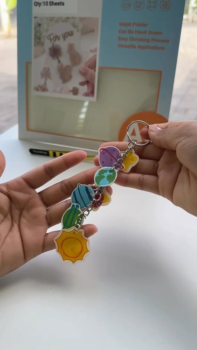 Instagram post by @madebyrakna for TeckWrapcraft. Caption reads: [...] #giftidea #shrinksheet #diykeychain....