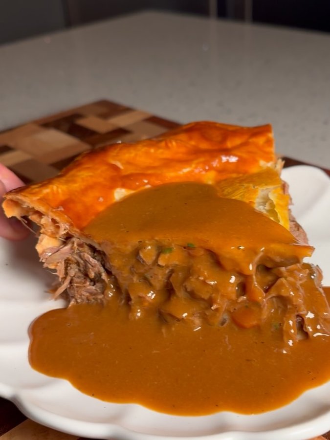 Instagram post by @notorious_foodie for Le Creuset. Caption reads: Lamb Shank Pie - up on Substack this Sunday....