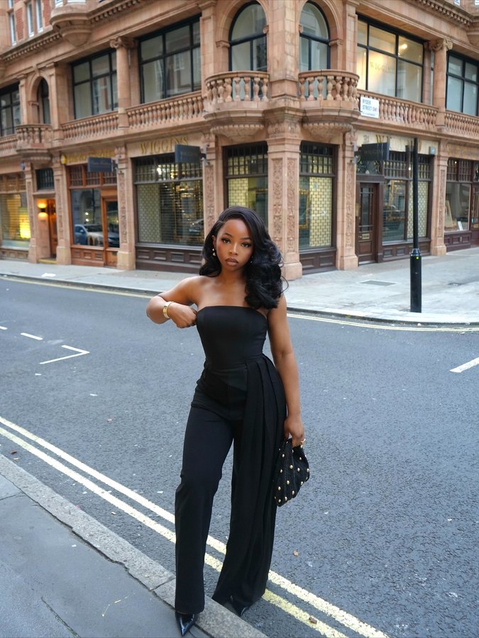 Instagram post by @iamemmanuela_ for Anthropologie. Caption reads: Party season, redefined with timeless elegance....