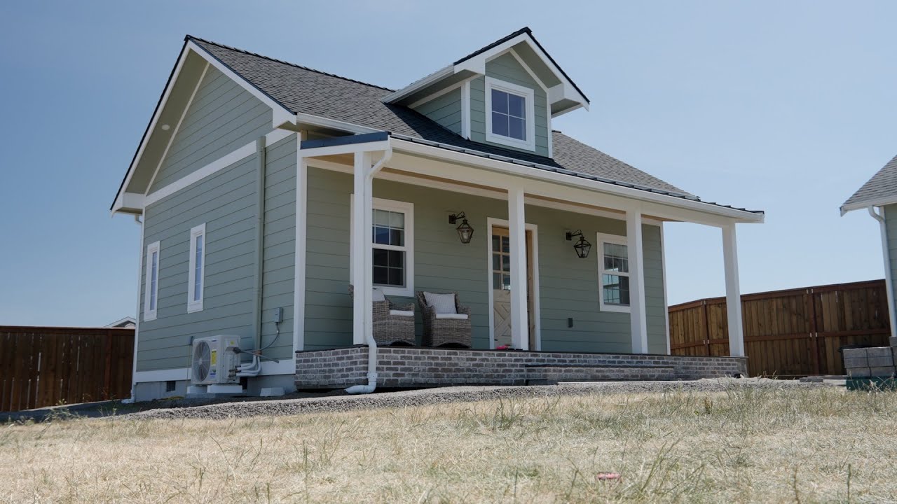 YouTube post by @LivingitCountry for Flooret. Caption reads: Tiny 400 SQ FT Empty Home Tour 2025.