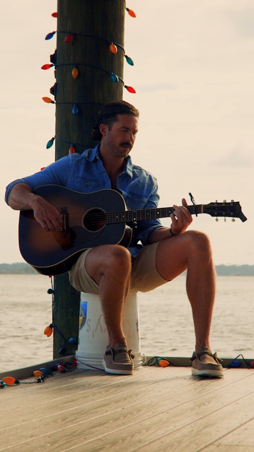 Instagram post by @rileyduckman for HEYDUDE. Caption reads: ’tis the season of comfort and good company....