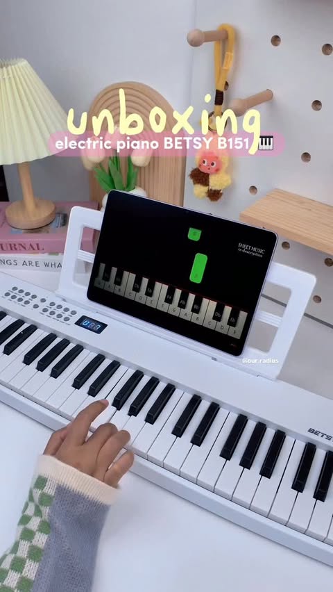 Instagram post by @our.radius for Shopee Malaysia. Caption reads: Foldable Portable Piano Keyboard BETSY B151 61....