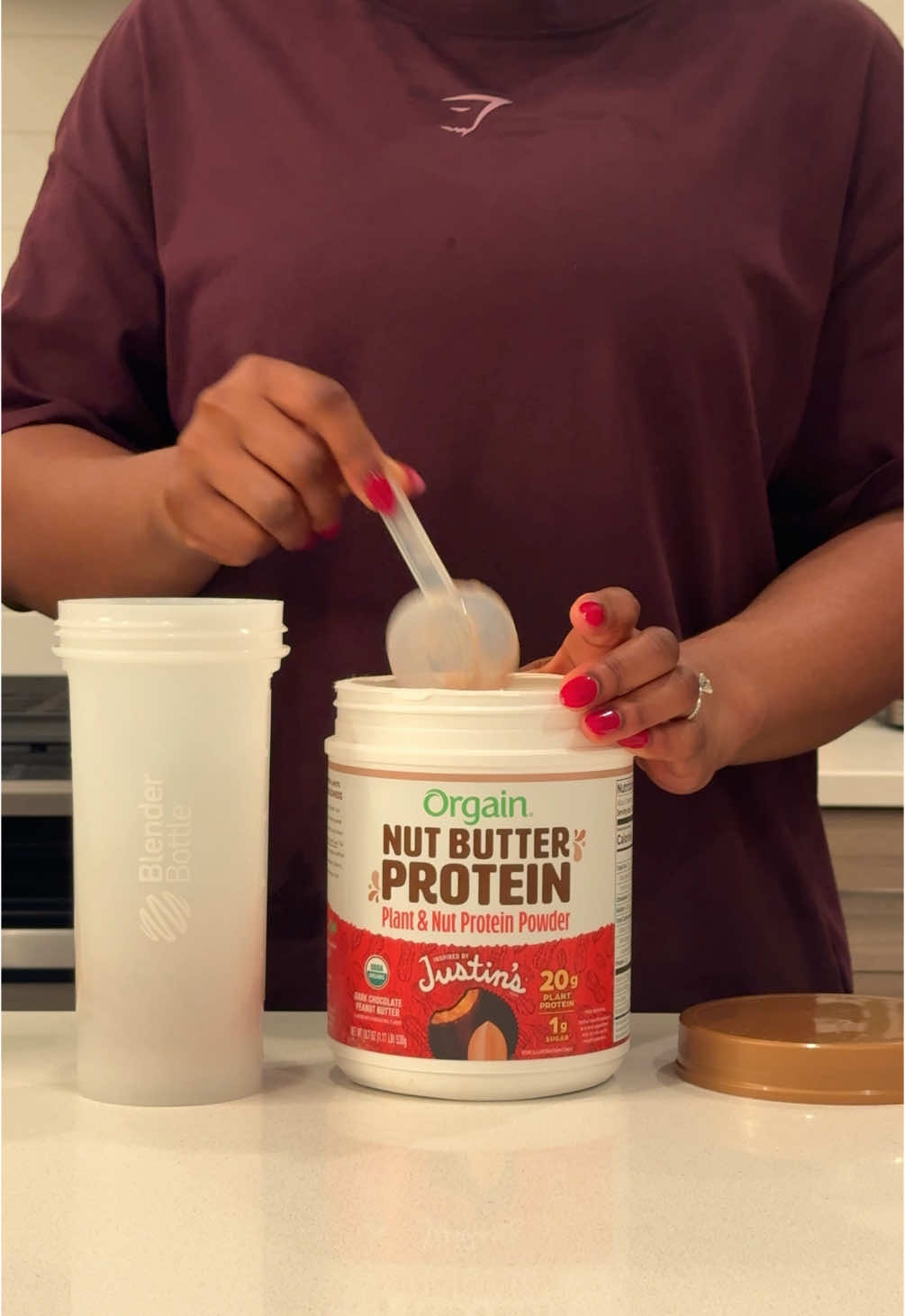 TikTok post by @uchembastrives for Orgain. Caption reads: If you’re as big of a fan of Justin’s Nut Butter....